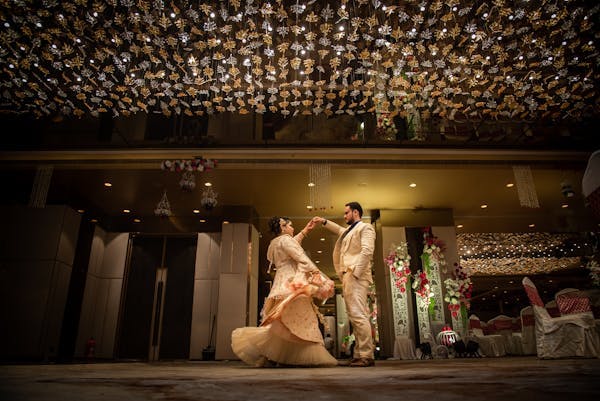 Groom dancing with his pretty wife pic