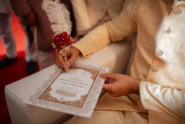 Groom signing his Nikah nama pic